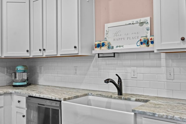 kitchen with decorative backsplash, white cabinetry, dishwasher, and sink