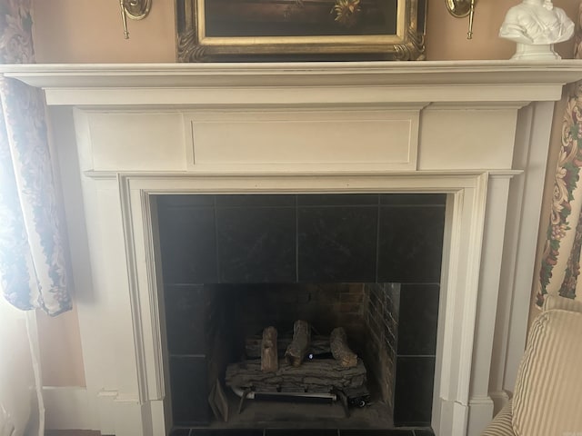 details with a tiled fireplace