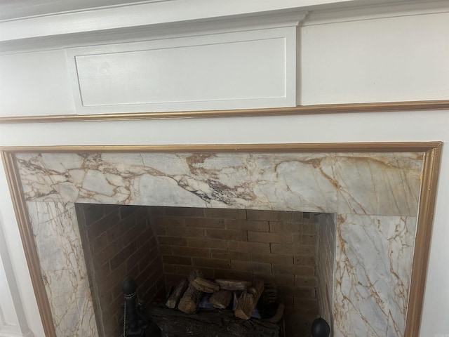 details with a stone fireplace