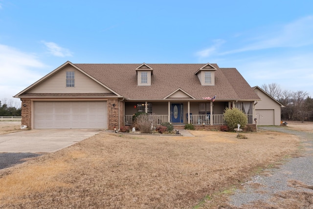 view of front facade featuring a garage and covered porch