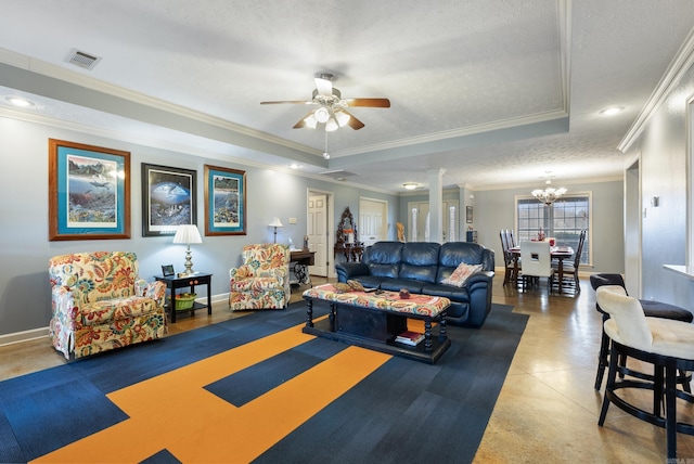 living room featuring ceiling fan with notable chandelier, ornate columns, ornamental molding, a textured ceiling, and a tray ceiling