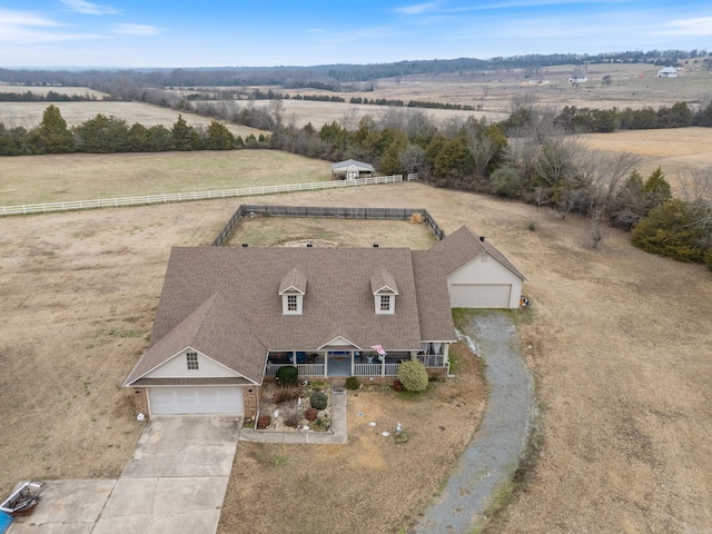 birds eye view of property with a rural view