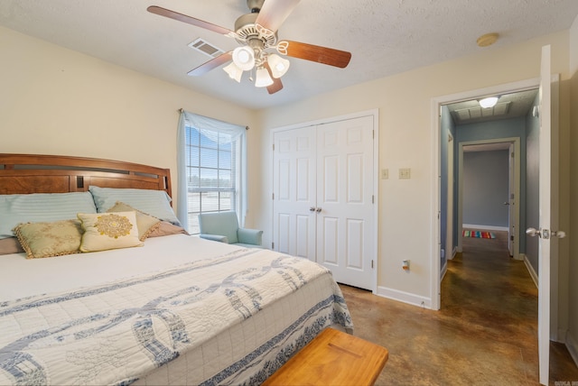 bedroom with a textured ceiling, a closet, and ceiling fan