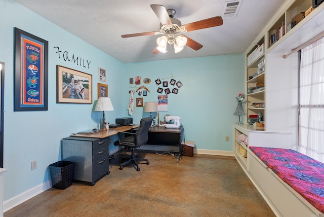 office with concrete flooring, a textured ceiling, and ceiling fan