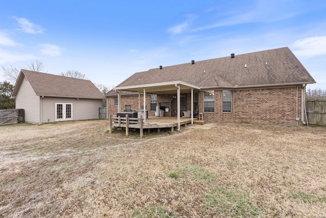 back of property featuring french doors and a deck