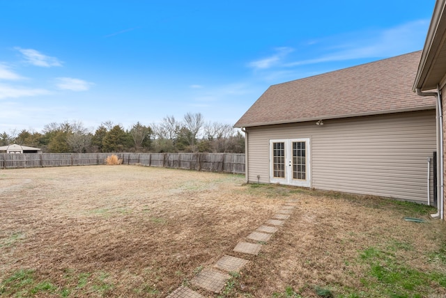 view of yard featuring french doors