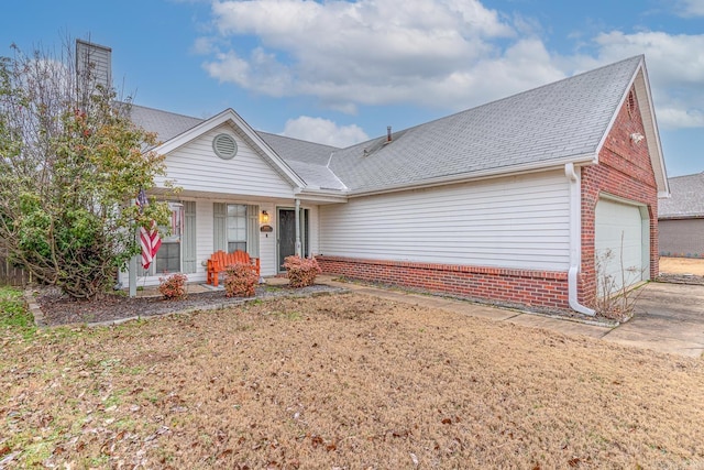 ranch-style home with covered porch and a garage