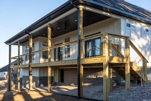 rear view of property featuring ceiling fan