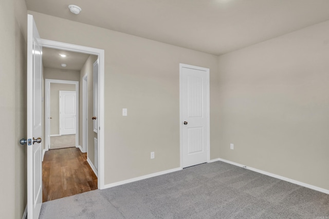 unfurnished bedroom featuring baseboards and carpet floors