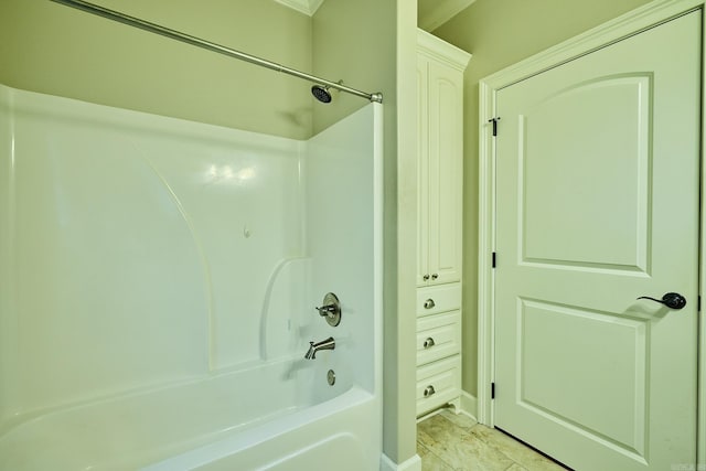 bathroom with tile patterned floors and bathtub / shower combination