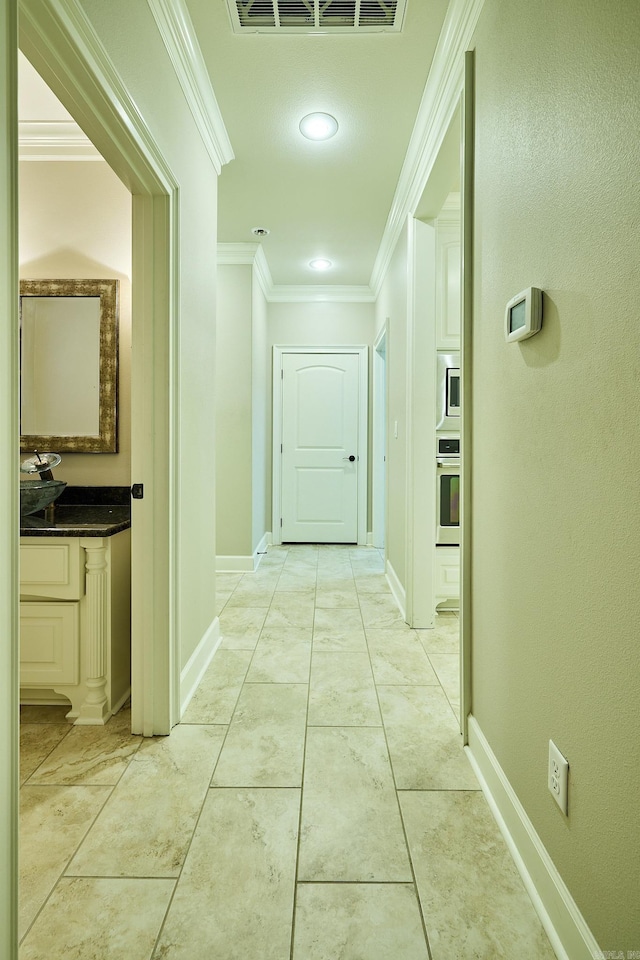 hallway with crown molding