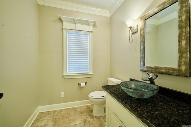 bathroom featuring vanity, toilet, and ornamental molding