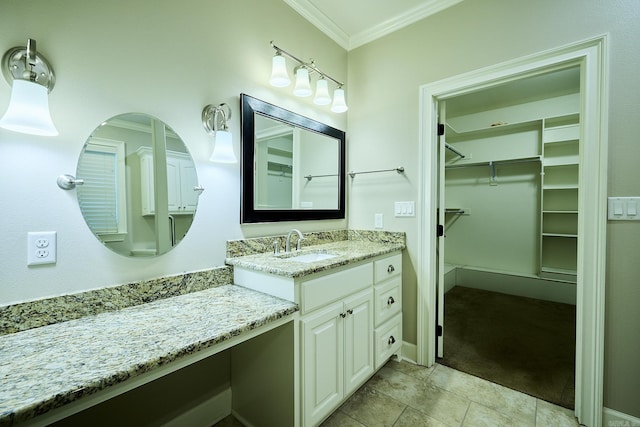 bathroom featuring tile patterned flooring, vanity, and ornamental molding