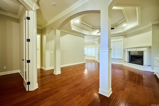 unfurnished living room with hardwood / wood-style flooring, crown molding, and a tray ceiling