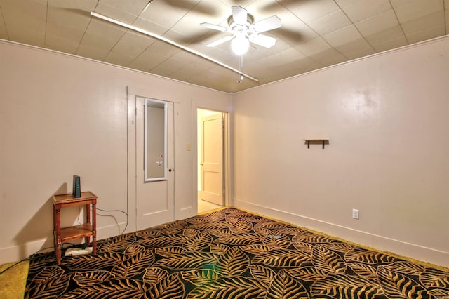 carpeted bedroom featuring ceiling fan and ornamental molding