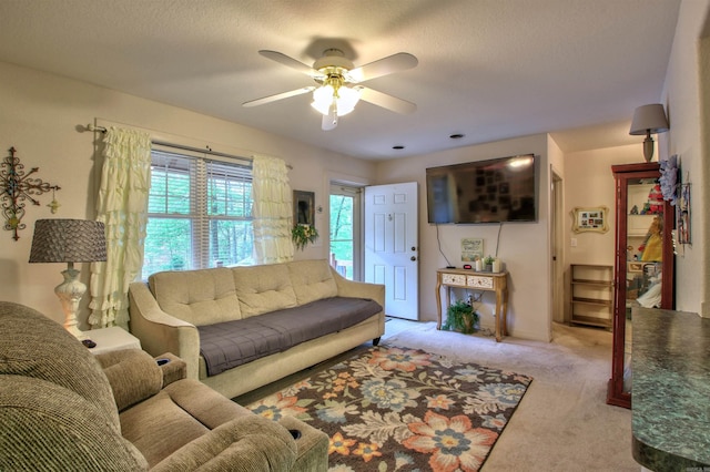 living room featuring ceiling fan and light carpet