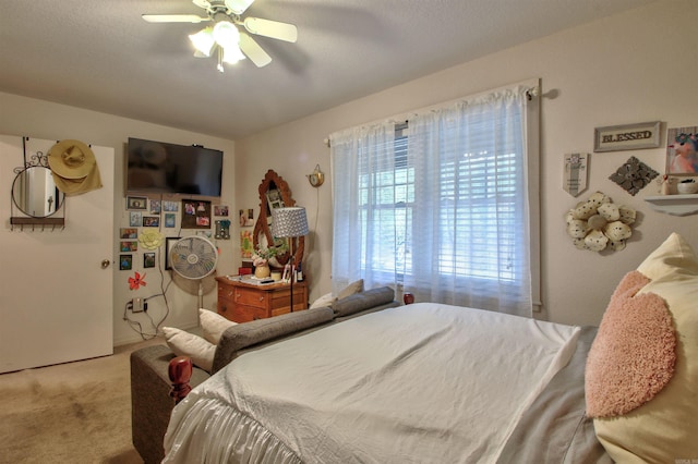 bedroom featuring ceiling fan and light colored carpet