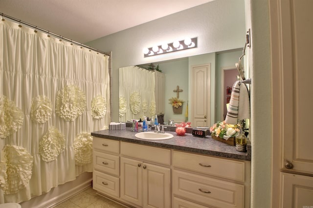 bathroom with vanity and shower / tub combo with curtain