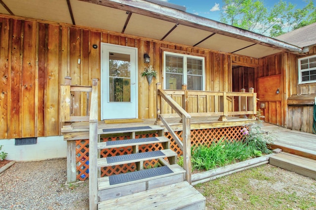 view of exterior entry featuring a porch