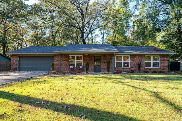 ranch-style home with a front yard and a garage