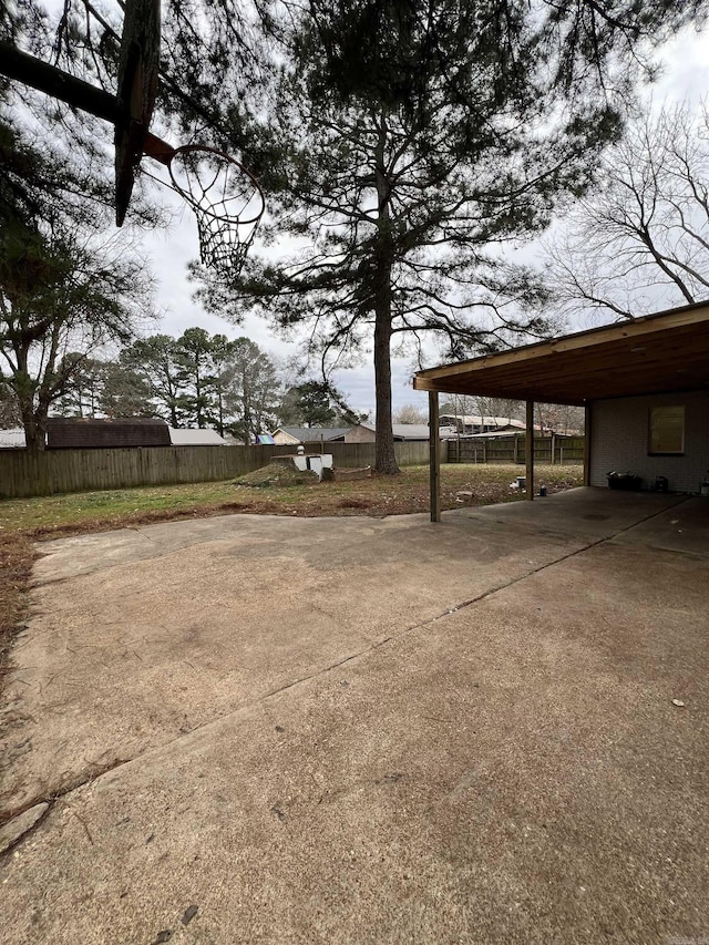 exterior space with a carport