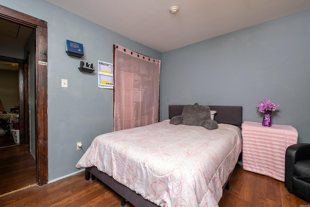 bedroom featuring dark wood-type flooring