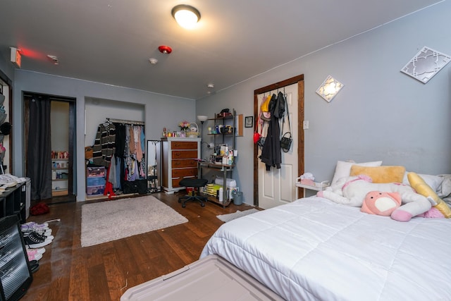 bedroom featuring dark hardwood / wood-style floors