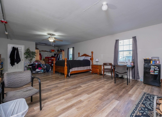 bedroom featuring ceiling fan and light hardwood / wood-style flooring