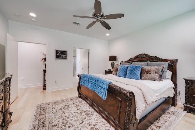 bedroom featuring light hardwood / wood-style floors and ceiling fan