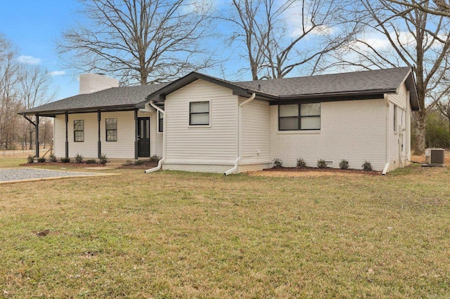 ranch-style home featuring central AC and a front lawn