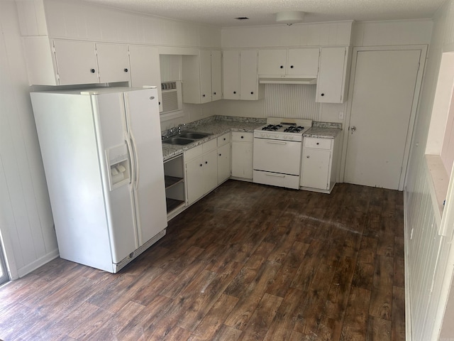 kitchen featuring sink, dark hardwood / wood-style flooring, a textured ceiling, white appliances, and white cabinets