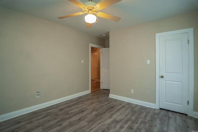 unfurnished bedroom featuring ceiling fan and hardwood / wood-style flooring