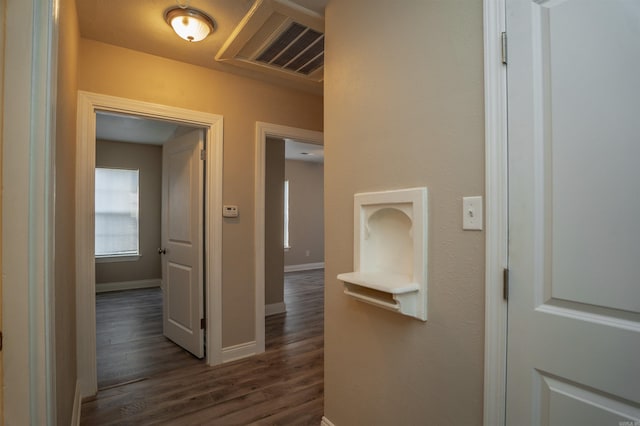 corridor with dark wood-type flooring