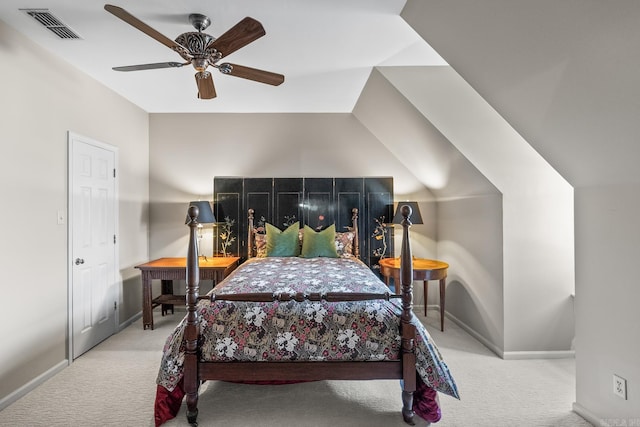 bedroom featuring ceiling fan, lofted ceiling, and light carpet