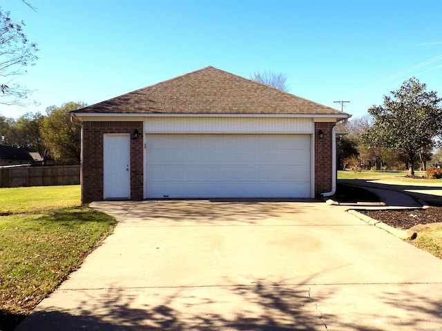 garage with a lawn