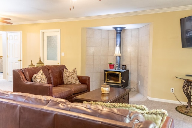 tiled living room with ceiling fan, a wood stove, and crown molding