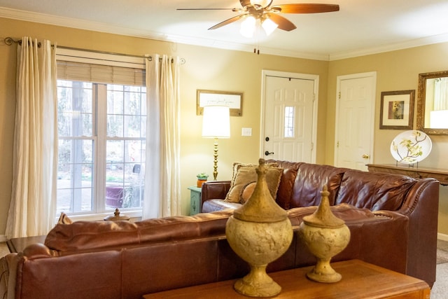 carpeted living room featuring ceiling fan and ornamental molding