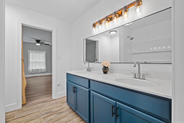 bathroom featuring vanity and ceiling fan