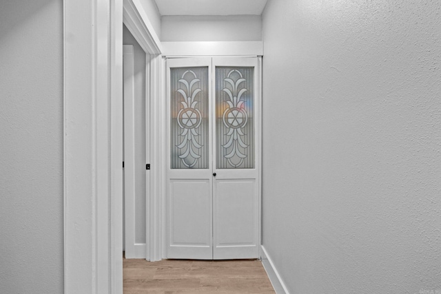 hall featuring light hardwood / wood-style floors