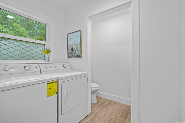 laundry room with separate washer and dryer