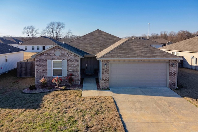 ranch-style house with a front yard and a garage