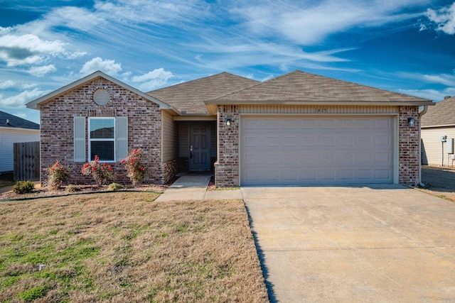 view of front of home with a garage and a front yard