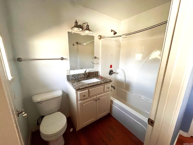 full bathroom with shower / bath combination, vanity, wood-type flooring, and toilet