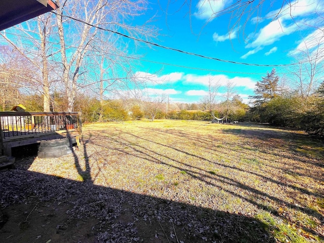 view of yard with a wooden deck