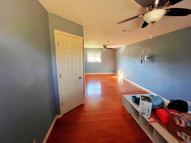 corridor featuring hardwood / wood-style floors