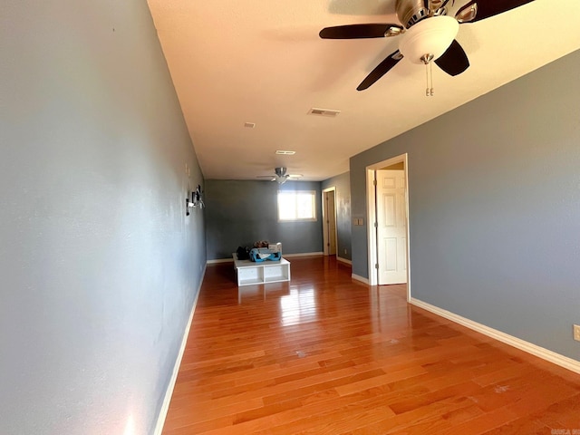 spare room featuring hardwood / wood-style flooring and ceiling fan