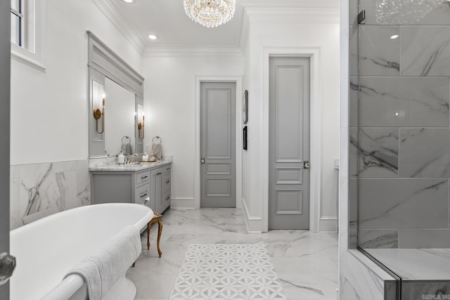 bathroom with a bathtub, vanity, a notable chandelier, and ornamental molding