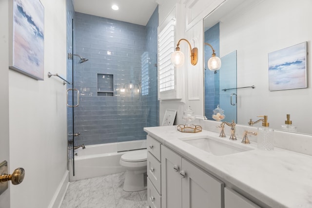 full bathroom featuring vanity, toilet, and tiled shower / bath