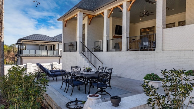 view of patio featuring ceiling fan