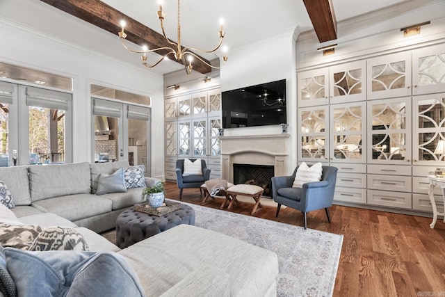 living room with french doors, dark wood-type flooring, an inviting chandelier, beamed ceiling, and crown molding